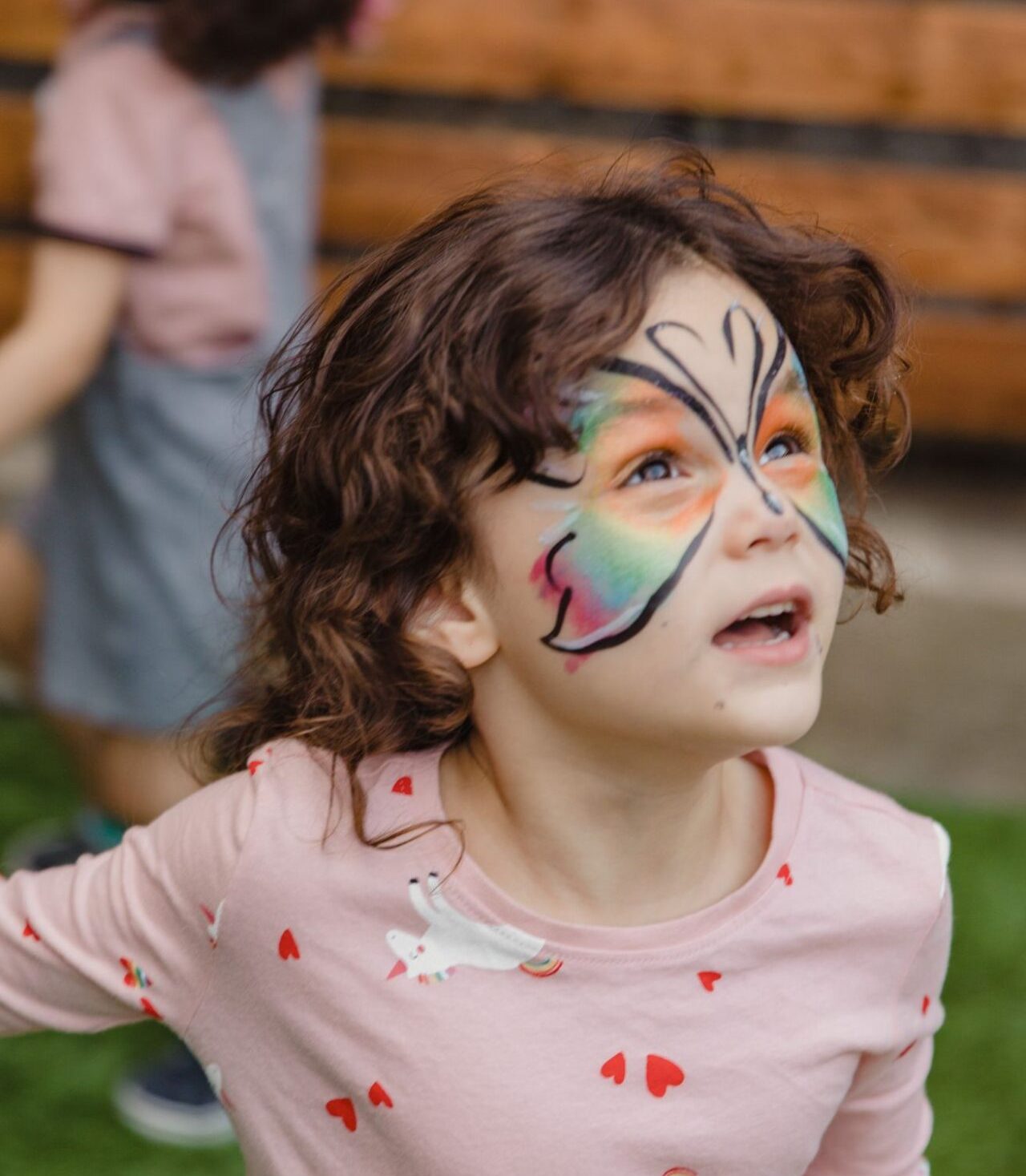 Child with butterfly face painting